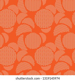 Seamless orange pattern with randomly arranged circles with a wave-like filling. Vector illustration