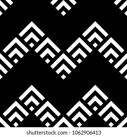 Seamless oriental mountains pattern. Repeated chevrons, diamonds, angle brackets background. Squama ornament. Scales image. Ancient window tracery motif. Digital paper, textile print. Vector artwork.
