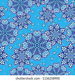 Seamless oriental ornamental pattern. Vector laced decorative background with floral and geometric ornament. Repeating tiles with mandala. Indian or Arabic motive.