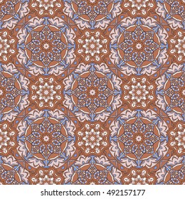 Seamless oriental ornamental pattern. Vector laced decorative background with floral and geometric ornament. Repeating geometric tiles with mandala. Indian or Arabic motive. Boho festival style.