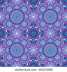 Seamless oriental ornamental vector pattern. Laced decorative background with round floral and geometric ornament. Repeating inwrought mandala tiles. Indian or Arabic motif. Boho festival style.