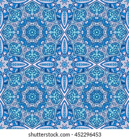 Seamless oriental ornamental vector pattern. Laced decorative background with round floral and geometric ornament. Repeating inwrought mandala tiles. Indian or Arabic motif. Boho festival style.