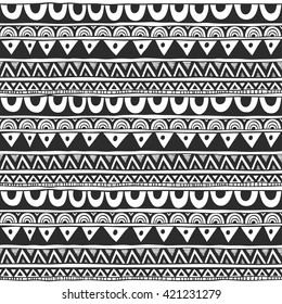 Seamless ornament from circle geometric elements in ethnic style black and white