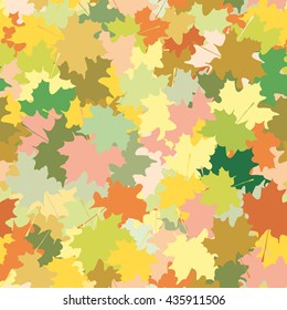 Seamless ornament consisting of a mass of maple leaves of different colors. Autumn template.Vector illustration.