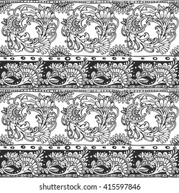Seamless ornament from doodle flowers elements in ethnic style black and white