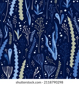 Seamless ornament with seaweed and bubbles on dark blue background. Underwater vector pattern.