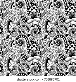 Seamless ornamental ethnic black and white pattern. Floral background with flowers, berries, waves, leaves, curly lines. Good for wallpaper, pattern fills, textile, fabric, wrapping, surface textures.