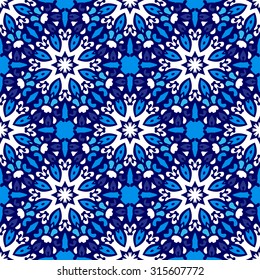 Seamless ornamental vector design for fabric. Abstract winter snowflake pattern