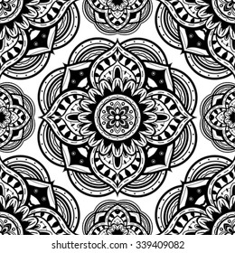 Seamless ornate pattern of the mandalas on a white background. Vector ornament with round decorative elements. Template for shawls, carpets, textiles.