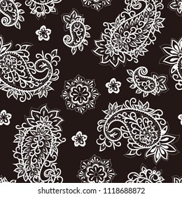 
Seamless paisley pattern on a black background. Elegant hand drawn vector design elements.