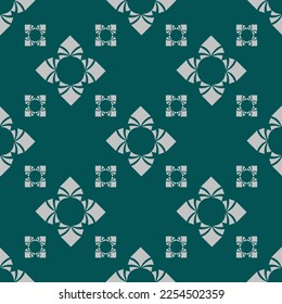 Seamless paisley pattern on green background.