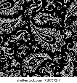 Seamless paisley pattern. Turkish cucumber - trace. White flowers and curls on a black background. Handmade. Prints for textiles. Boho style. Vector illustration.