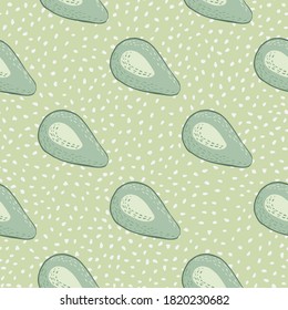 Seamless pale pattern with avocado fruit silhouettes. Diagonal raw ornament on dotted background. Food backdrop in green tones. For wallpaper, textile, wrapping, fabric print. Vector illustration.