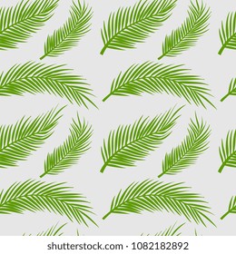 Seamless palm leaves. Coconut leaf pattern for summer holiday fashion textile or background. Green tropical ready for print.