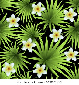 Seamless palm pattern. Leaves and flowers of a tropical blooming green palm tree on a black background. Tropical flowers.