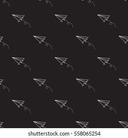 Seamless paper plane pattern on black background