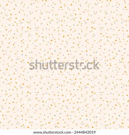 Seamless pastel terrazzo pattern. Pink, cream and mustard yellow terrazzo texture speckled background. Soft pastel spring backdrop.