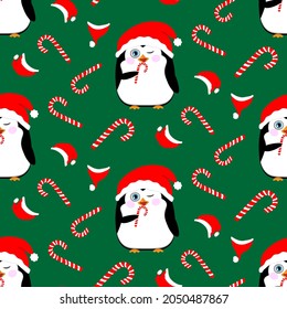 Seamless patten. Two cute Christmas penguins on a green background. Wearing a santa claus hat, a penguin licks a festive candy. Cute vector illustration with baby penguins.