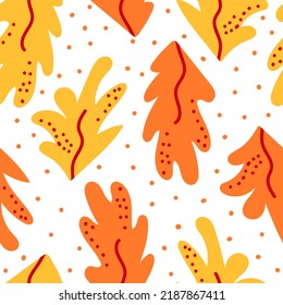 Seamless pattern with abstract autumn leaves and dots. Cute flat vector background