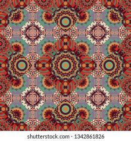 Seamless pattern abstract background. Vector illustration. Textile design texture. Ethnic tracery for print on textile. With saturated shapes in beige, green and red colors.