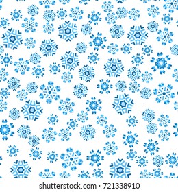 Seamless pattern with abstract colorful snowflakes on transparent background. Chaotic, random, scattered winter motives. Vector illustration.