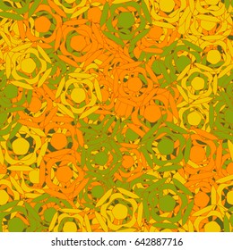 Seamless pattern. Abstract a five-sided figure. Chaotic order. Fashionable women's and children's camo. Green, yellow, red.