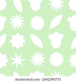 Seamless pattern with abstract floral and geometric white shapes on green background.
