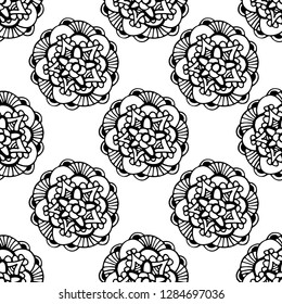 Seamless pattern with abstract flowers. Black and white hand-drawn floral background.