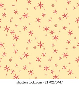 Seamless pattern with abstract flowers in the form of stars in a warm palette