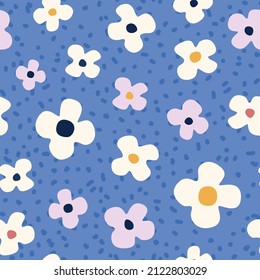 Seamless pattern with abstract flowers on a blue background in random order