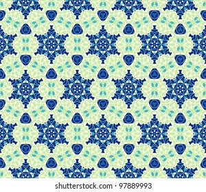 Seamless pattern with abstract flowers and stars in shades of green and blue