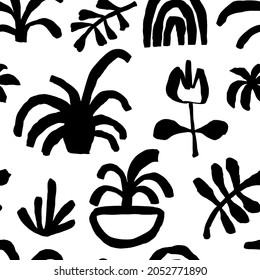 Seamless pattern with abstract free-form shapes in Matisse cut out style. Black and white ink elements.