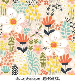 Seamless pattern with abstract hand-drawn flowers and plants on a yellow background in a vector.