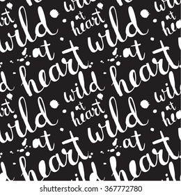 Seamless pattern with abstract handwriting modern ink text. Wild at heart.
