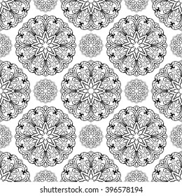 Seamless pattern of abstract mandala on a white background. Oriental ornament of round filigree elements. Template for carpet, shawl, wallpaper, embroidery.