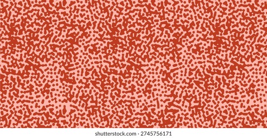 Seamless pattern with abstract orange and red speckled sponge texture