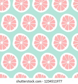 Seamless pattern with abstract orange slices on a green background. Vector illustration.