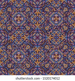 Seamless pattern. Abstract ornament of four-sided elements. Yellow, blue, purple, pink, violet.