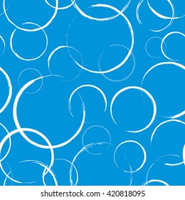 Seamless pattern with abstract white circles on blue background. Wrapping texture in vector EPS8 format.