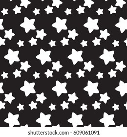 Seamless pattern. Abstract white stars on a black background. Vector illustration.