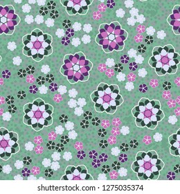 Seamless pattern. An abstraction containing large six-petal and small five-petal flowers. The background consists of small quadrangles.