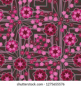 Seamless pattern. An abstraction containing large six-petal and small five-petal flowers. The background consists of large angular quadrilateral figures.
