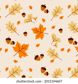 Seamless pattern with acorns and autumn oak leaves in orange, beige, brown and yellow. Perfect for wallpaper, gift paper, pattern fill, web page background, autumn greeting cards.