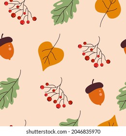 Seamless pattern with acorns, rowan, and autumn leaves in brown-yellow, orange, beige. Suitable for wallpaper, gift paper, web page background, autumn greeting cards.
