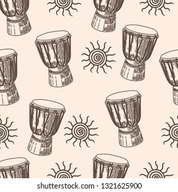 Seamless pattern with African drums and sun.