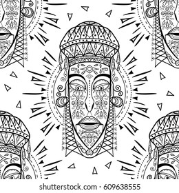 Seamless pattern with African masks. Hand drawn design for fashion, textile, fabric, wrapping paper, tiles, website wallpaper, background. Spirituality, occultism, mystic, religion, shamanism.