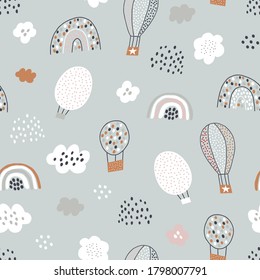 Seamless pattern with air ballons, rain, clouds and rainbows. Childish modern texture for fabric, wallpaper, textile, nursery and kindergarten. Vector illustration.