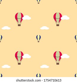 A seamless pattern with air balloons and clouds on beige background. Nursery wallpaper.