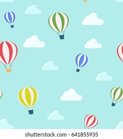 Seamless pattern of air balloons and clouds. Children's print vector illustration in modern flat style for background.