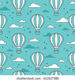 Seamless pattern with air balloons flying in the sky on turquoise background.